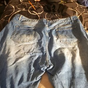 Heavy ripped/cut out jeans